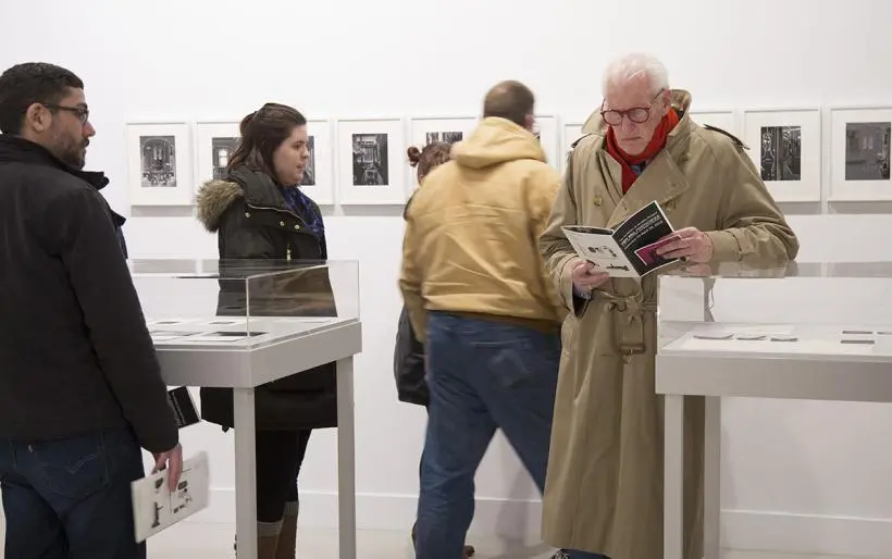 Visitors viewing Hill's exhibition.