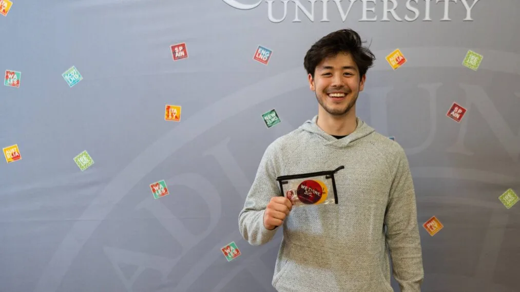 One of the winners of the Preview Photo and Video Contest poses with his prize