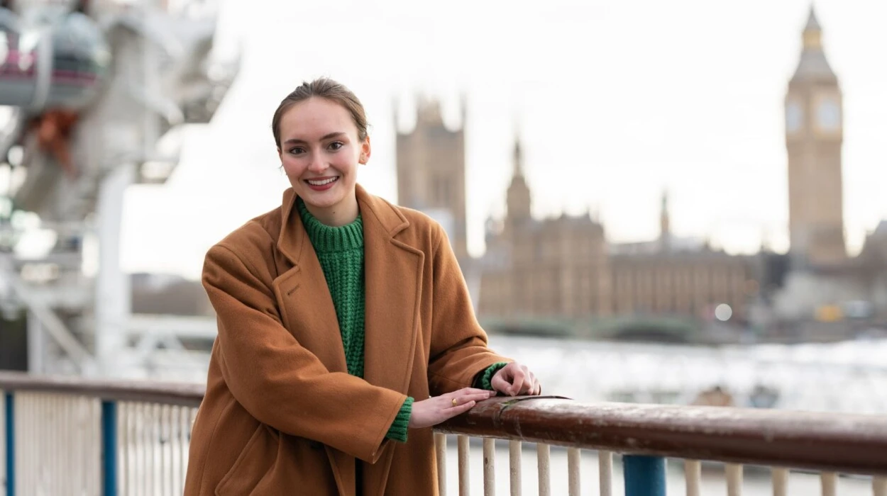 Sabine Costa stands outside Big Ben in London.