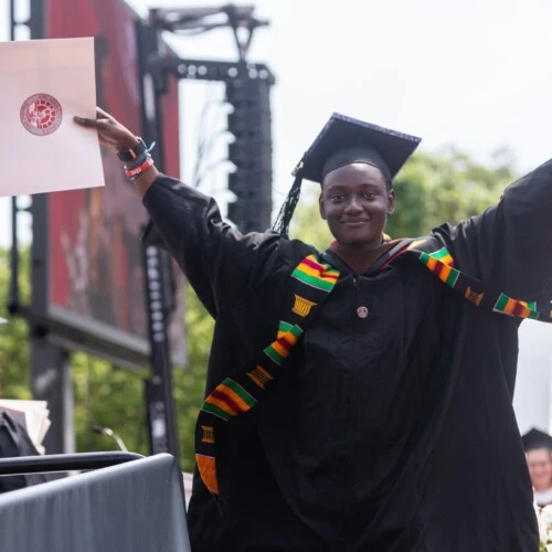 Ibrahim Sillah celebrates graduating from Arcadia.