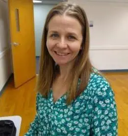 Dr. Becky Mathers-Lowery smiling in her office