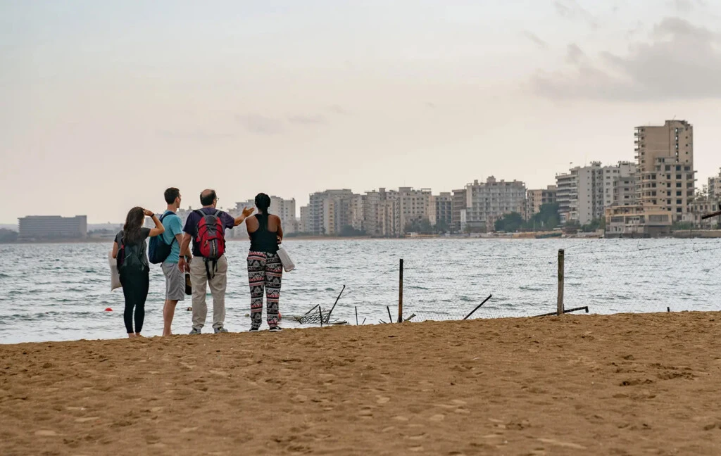 IPCR students take in a cityscape view on a beach overseas.