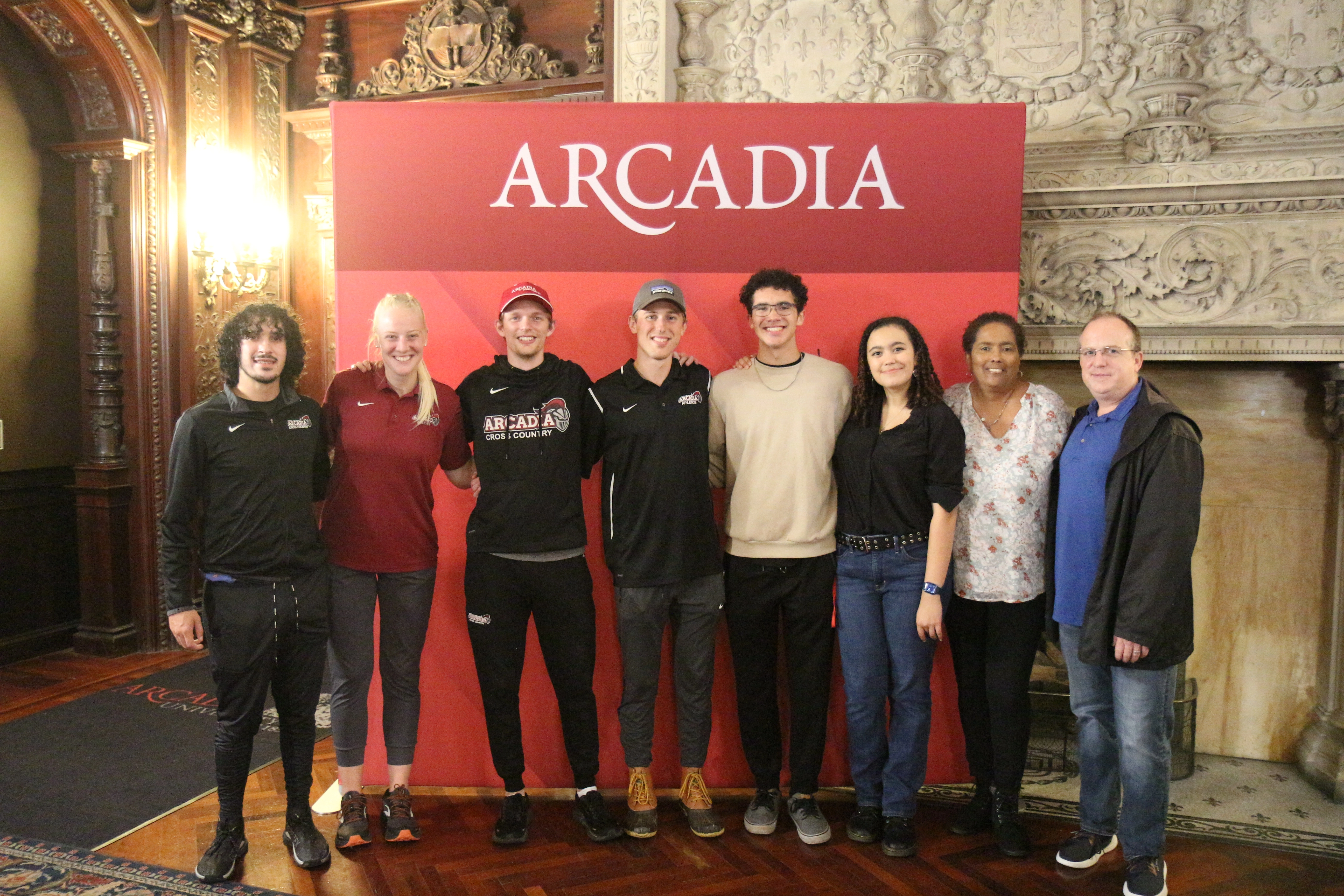 A group of people posing together for Homecoming in the castle