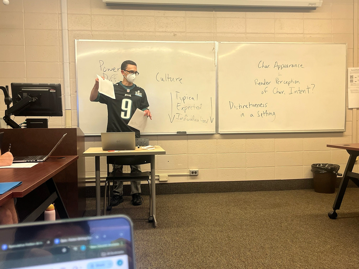 Professor Dan Schall standing in front of his classroom.