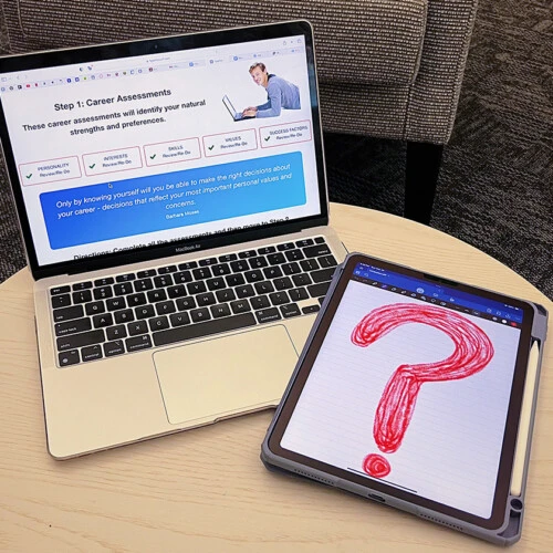 Lily's laptop on a table with a question mark next to it.