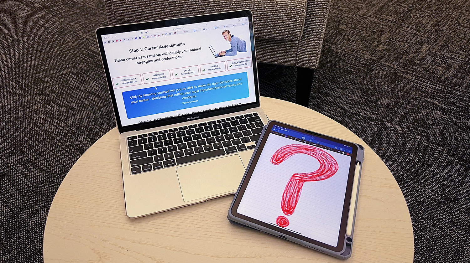 Lily's laptop on a table with a question mark next to it.