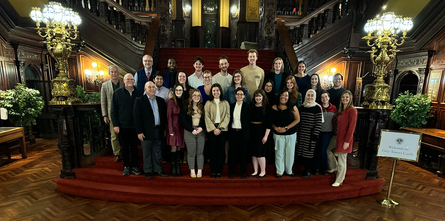 The Forensic Science class standing on the steps in the castle.