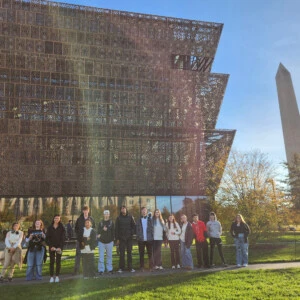 Prof. McCreery's FYS class standing outside of a museum.